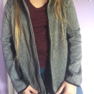 Gray/black jacket.